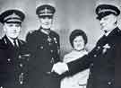 View: y13738 South Yorkshire Police: Police Constable Idriswyn Ford BEM (right) receiving an award from the Lord Lieutenant for South Yorkshire, Gerard F Young